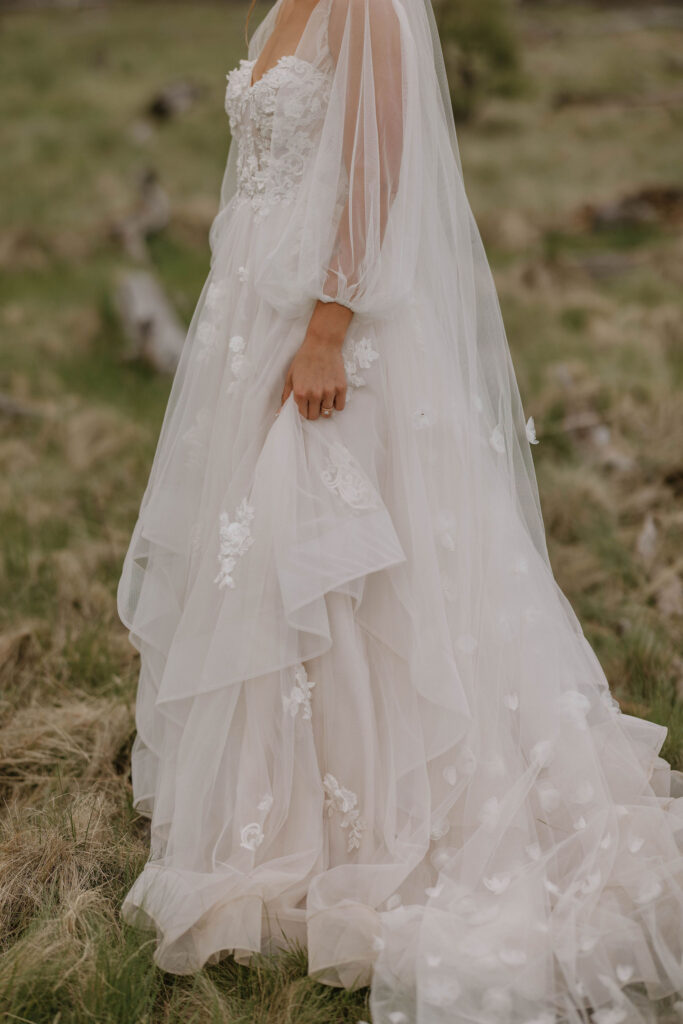 wedding dress detail photo during outdoor wedding day at arizona nordic village