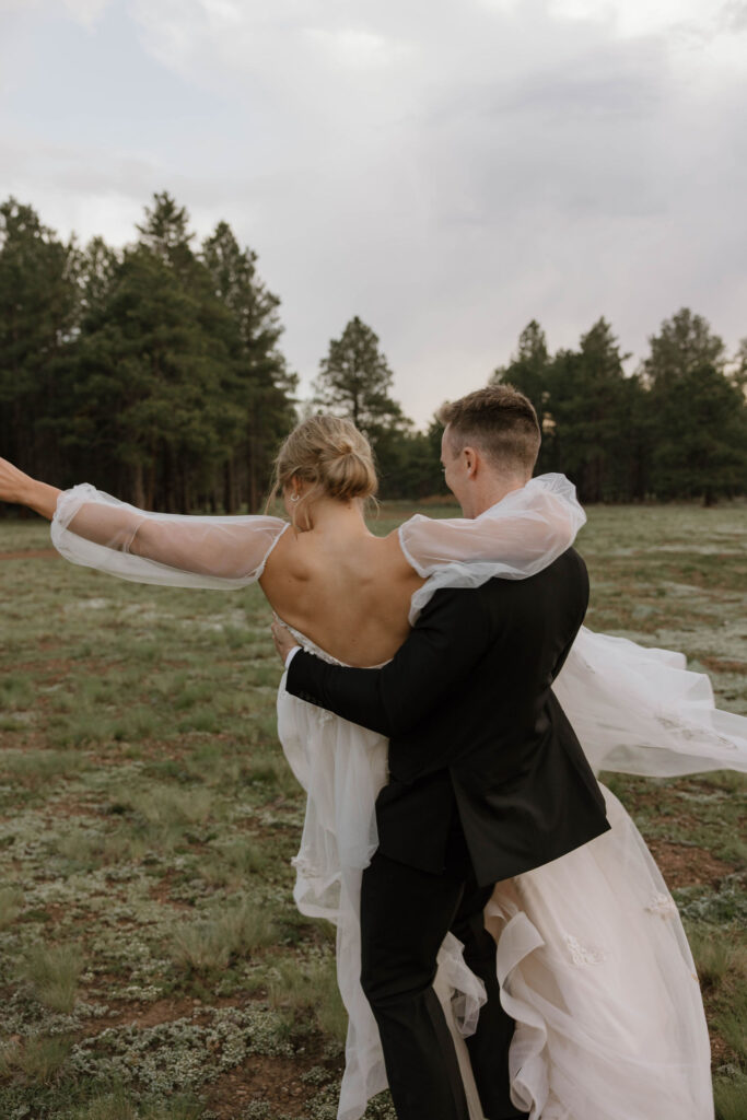 bride and groom dancing during outdoor wedding day at arizona nordic village