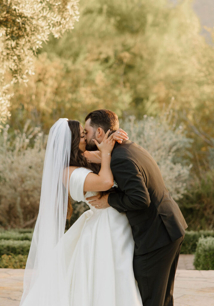 bride and groom kissing during wedding at el chorro lodge in pheonix