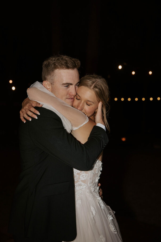 dance party photo in an outdoor forest wedding with bride and groom and family and friends