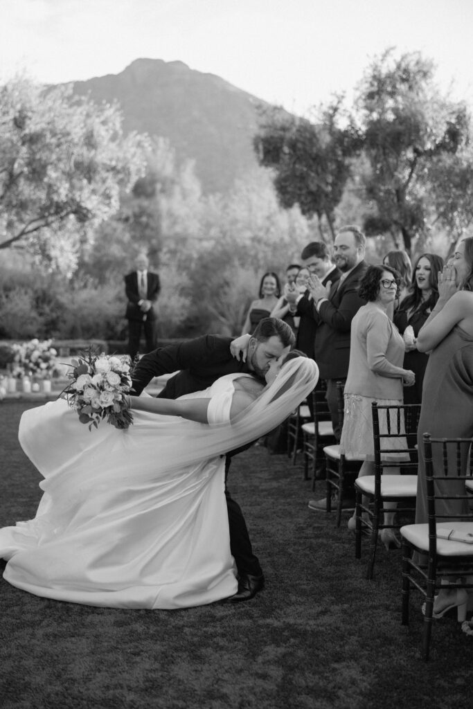 bride and groom kissing during wedding ceremony at el chorro lodge in pheonix