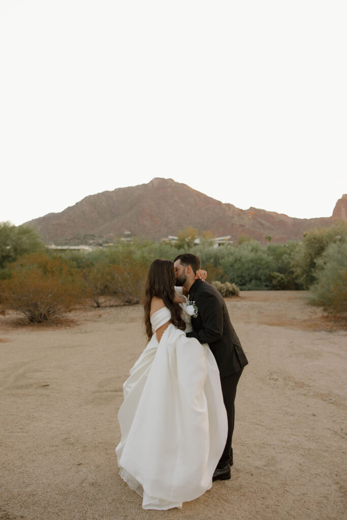 bride and groom kissing during wedding at el chorro lodge in pheonix