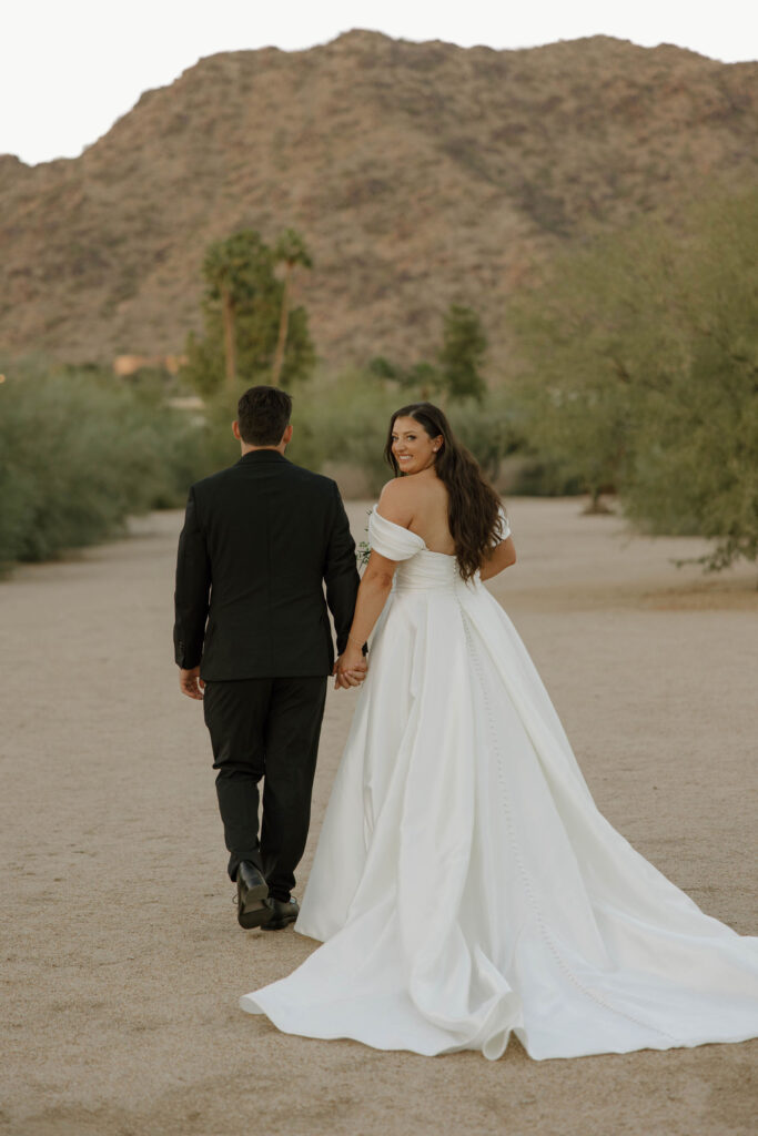 bride and groom photos in front of mountains in arizona