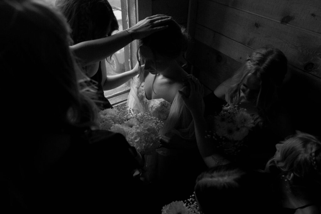 bride being prayed on before ceremony at arizona wedding day