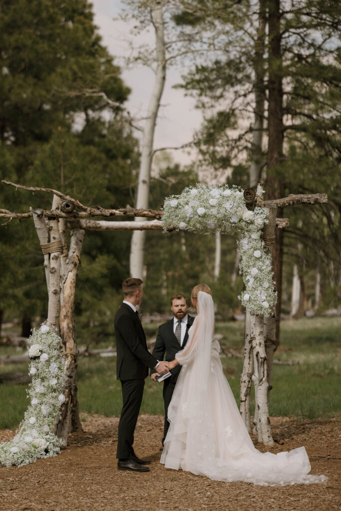 bride and groom at outdoor wedding ceremony day at arizona nordic village