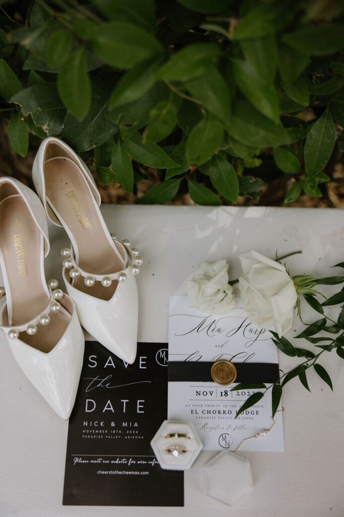 all white and black wedding details at reception during wedding at el chorro lodge in pheonix